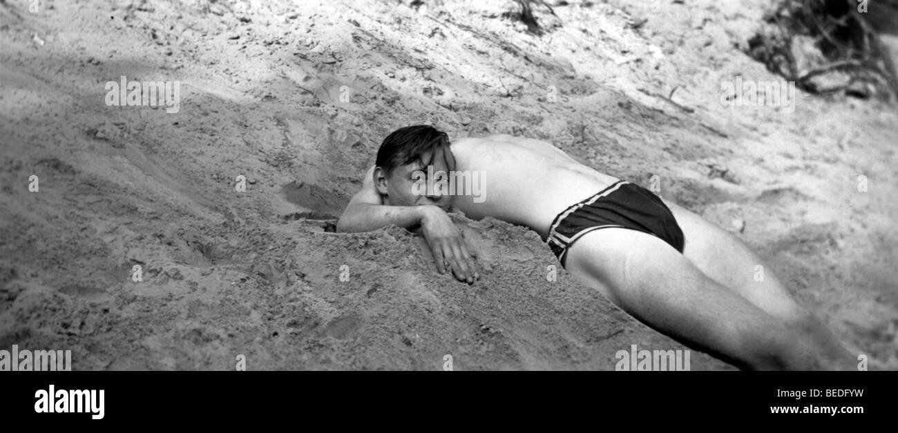 Historic photograph, headless, man buried in sand, around 1920 Stock Photo