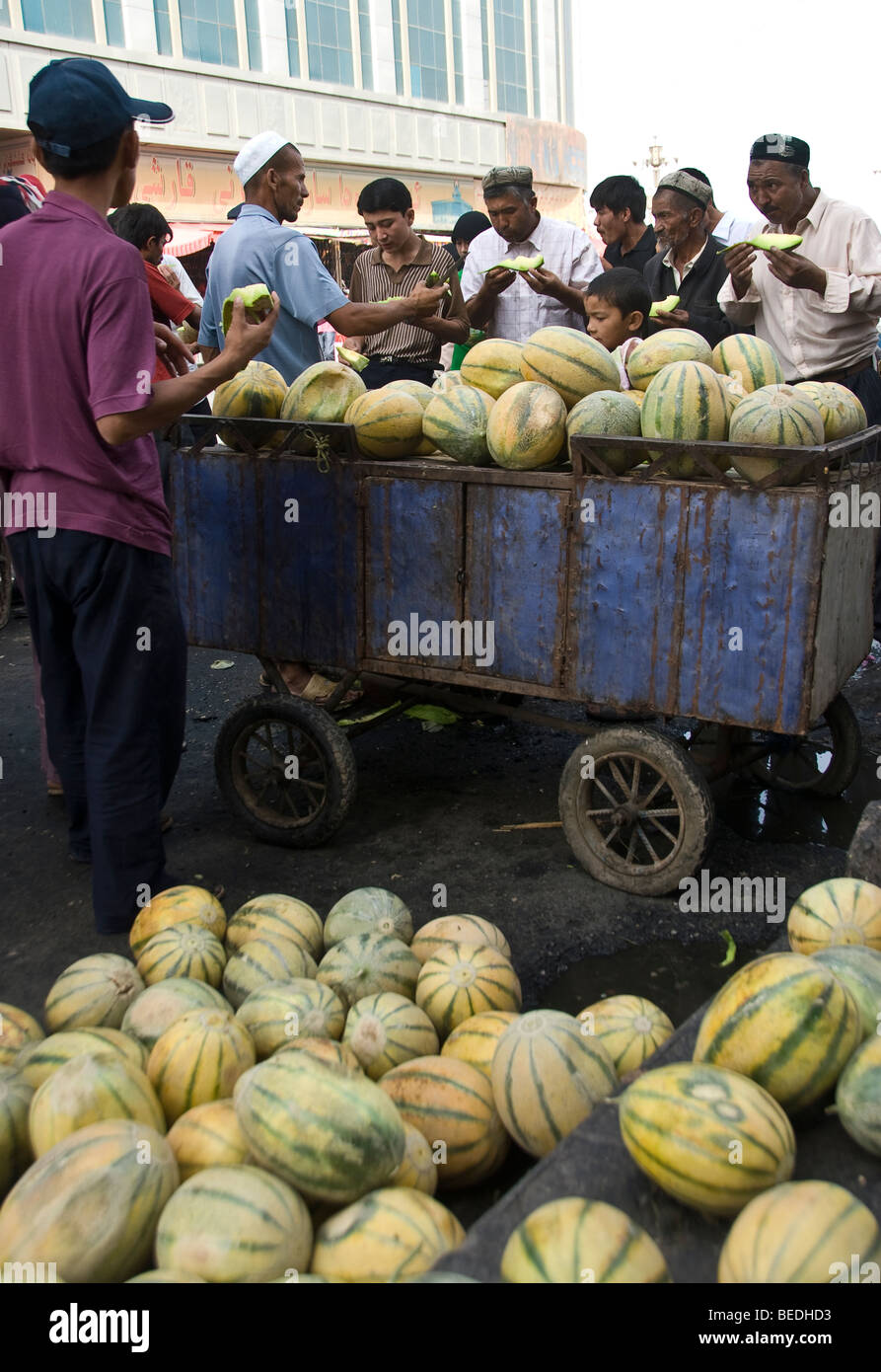 Market vendor eating melon hires stock photography and images Alamy