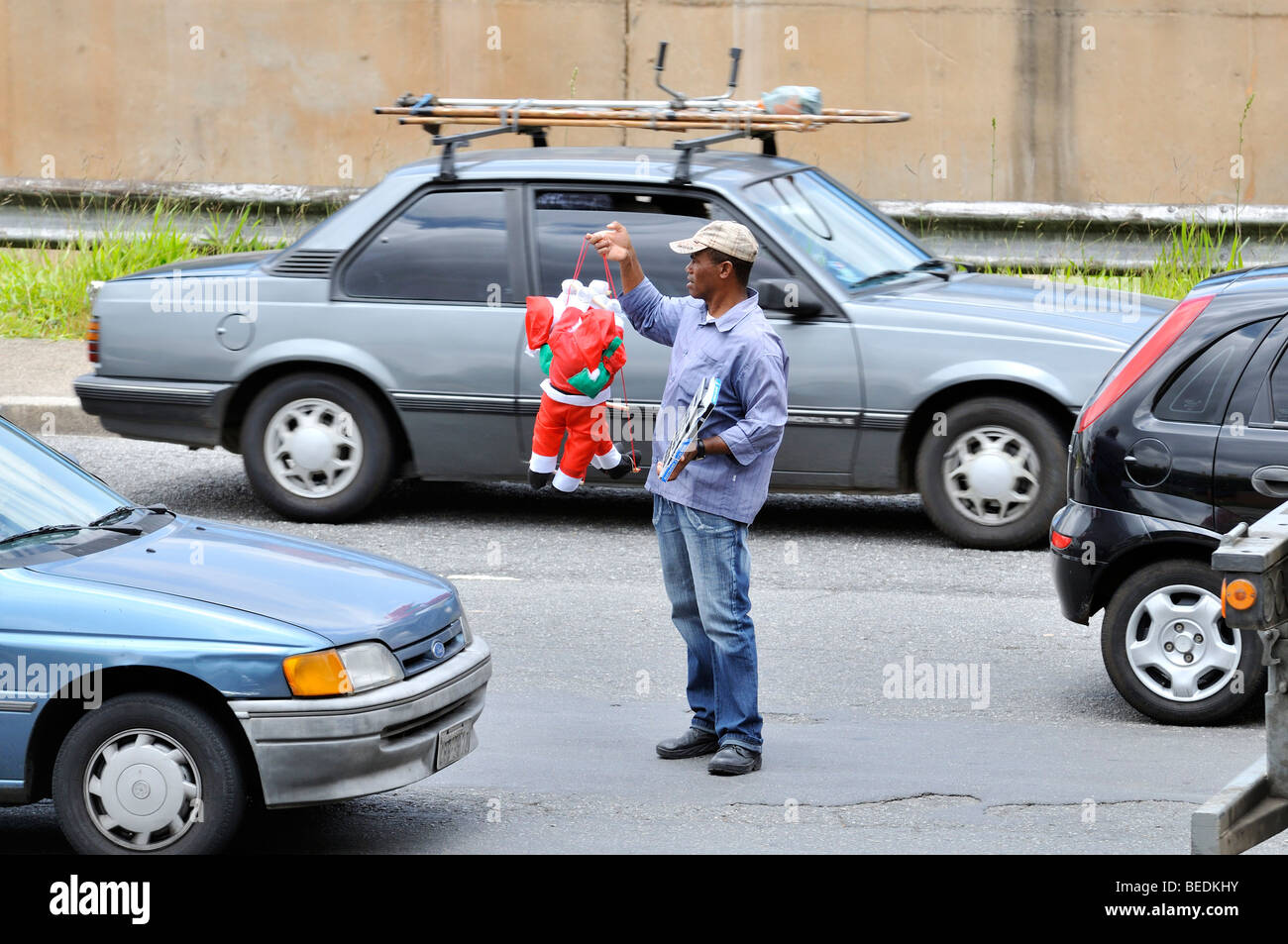 Man selling Father Christmas dolls in a traffic jam, Bras district, Sao Paulo, Brazil, South America Stock Photo