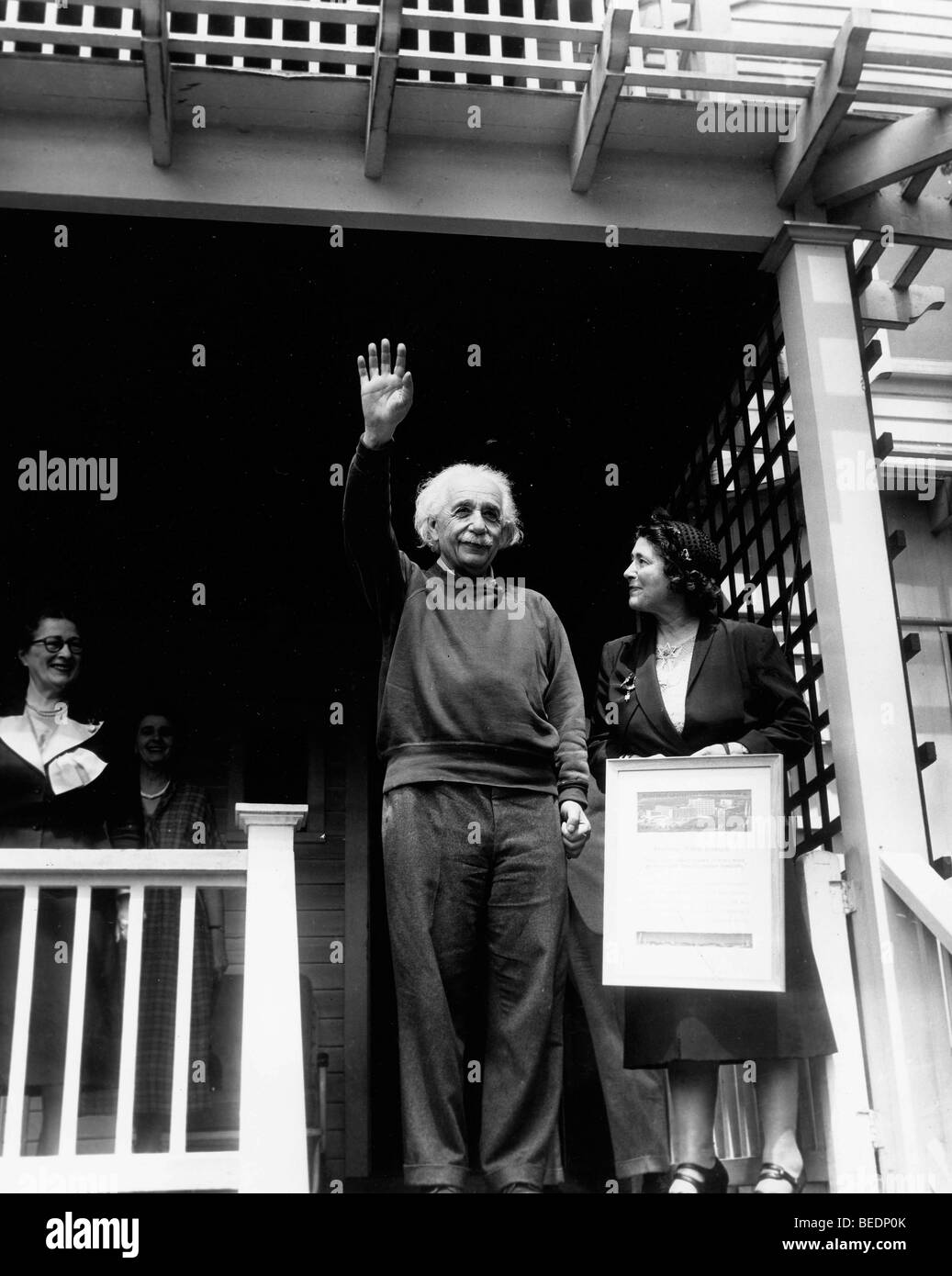 Professor Albert Einstein waves from the porch of his home in princeton Stock Photo