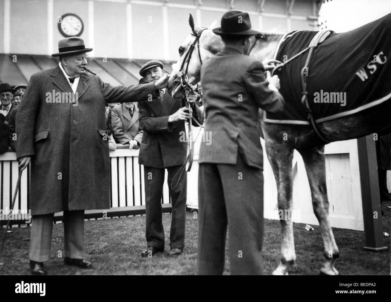 Sir Winston Churchill pets his horse at races Stock Photo