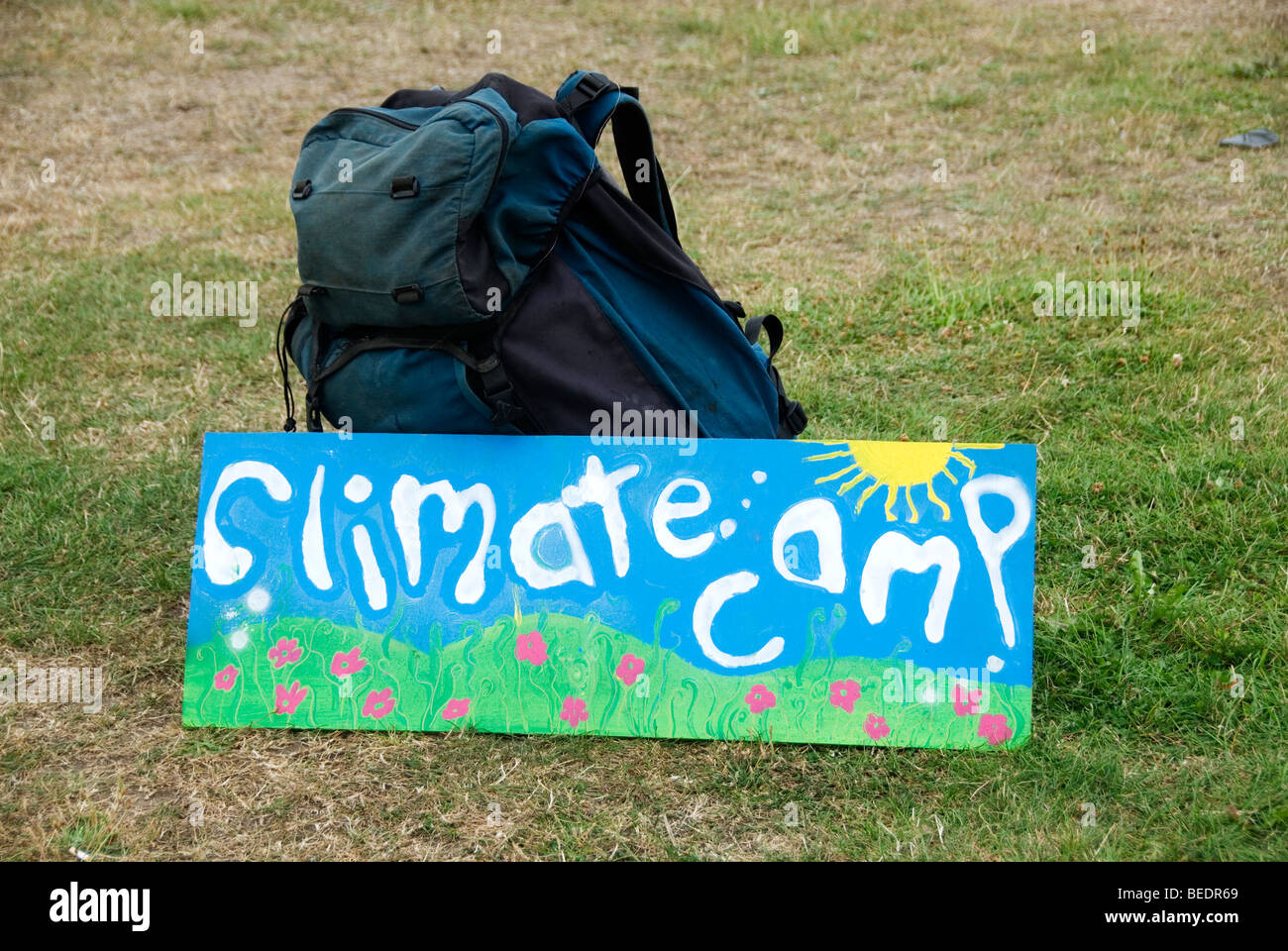 Climate Camp arrives at Blackheath. Rucksack and hand painted sign saying Climate camp Stock Photo