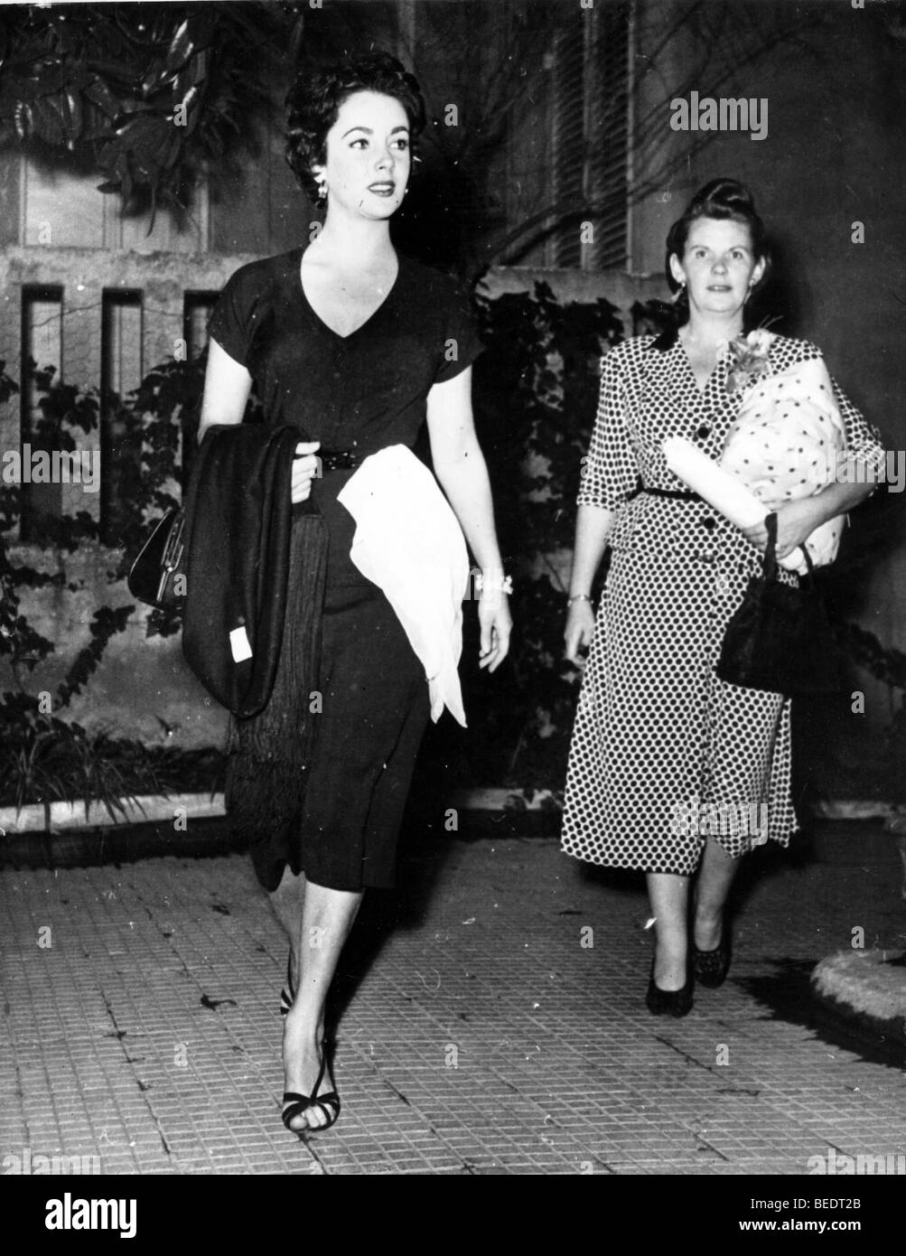 Actress Elizabeth Taylor leaving a building Stock Photo