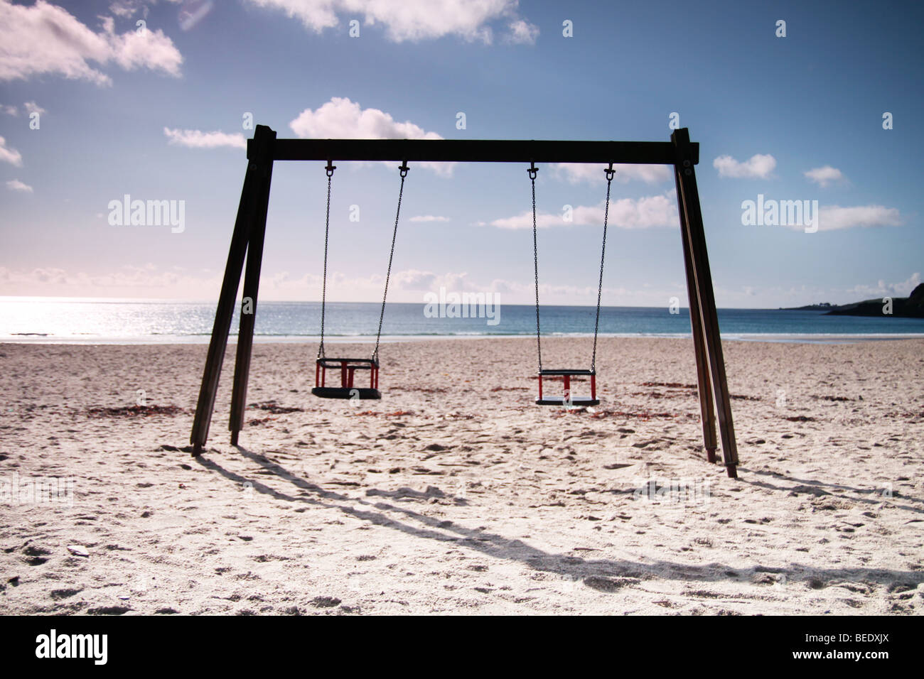 swings on a beach Stock Photo Alamy