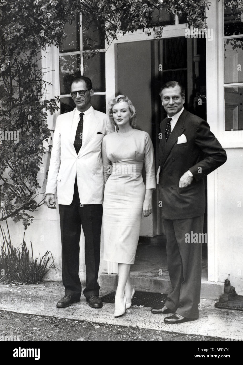 Marilyn Monroe with husband Arthur Miller and friend Laurence Olivier Stock Photo