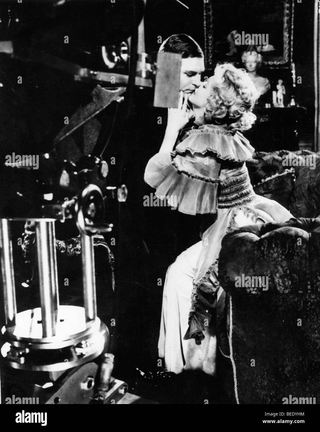 Sir Laurence Olivier and Marilyn Monroe share a kiss while filming 'The Sleeping Prince' Stock Photo