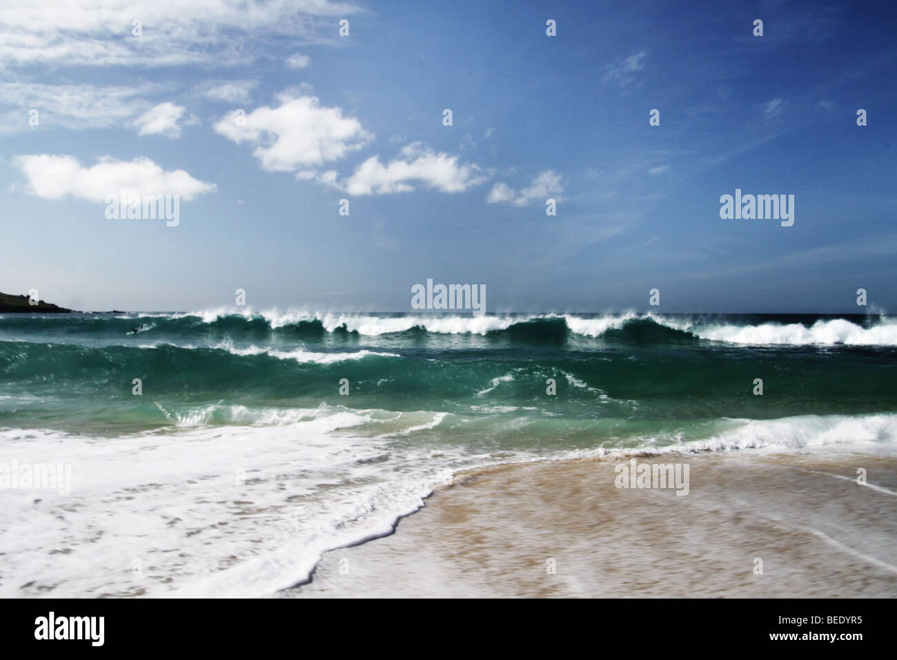 waves breaking onto the beach Stock Photo