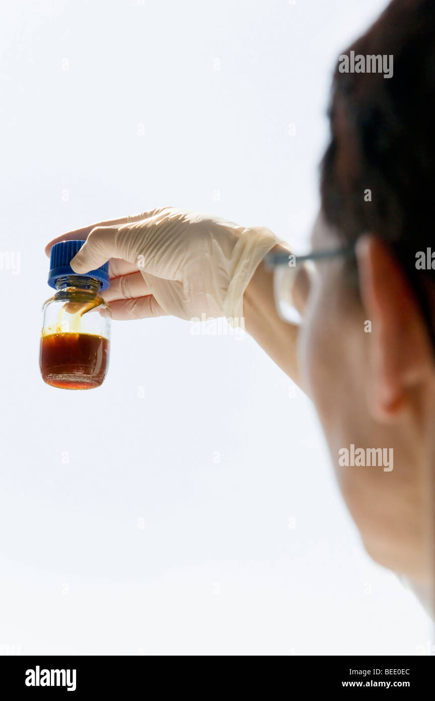 Examining a fluid, lab scene Stock Photo
