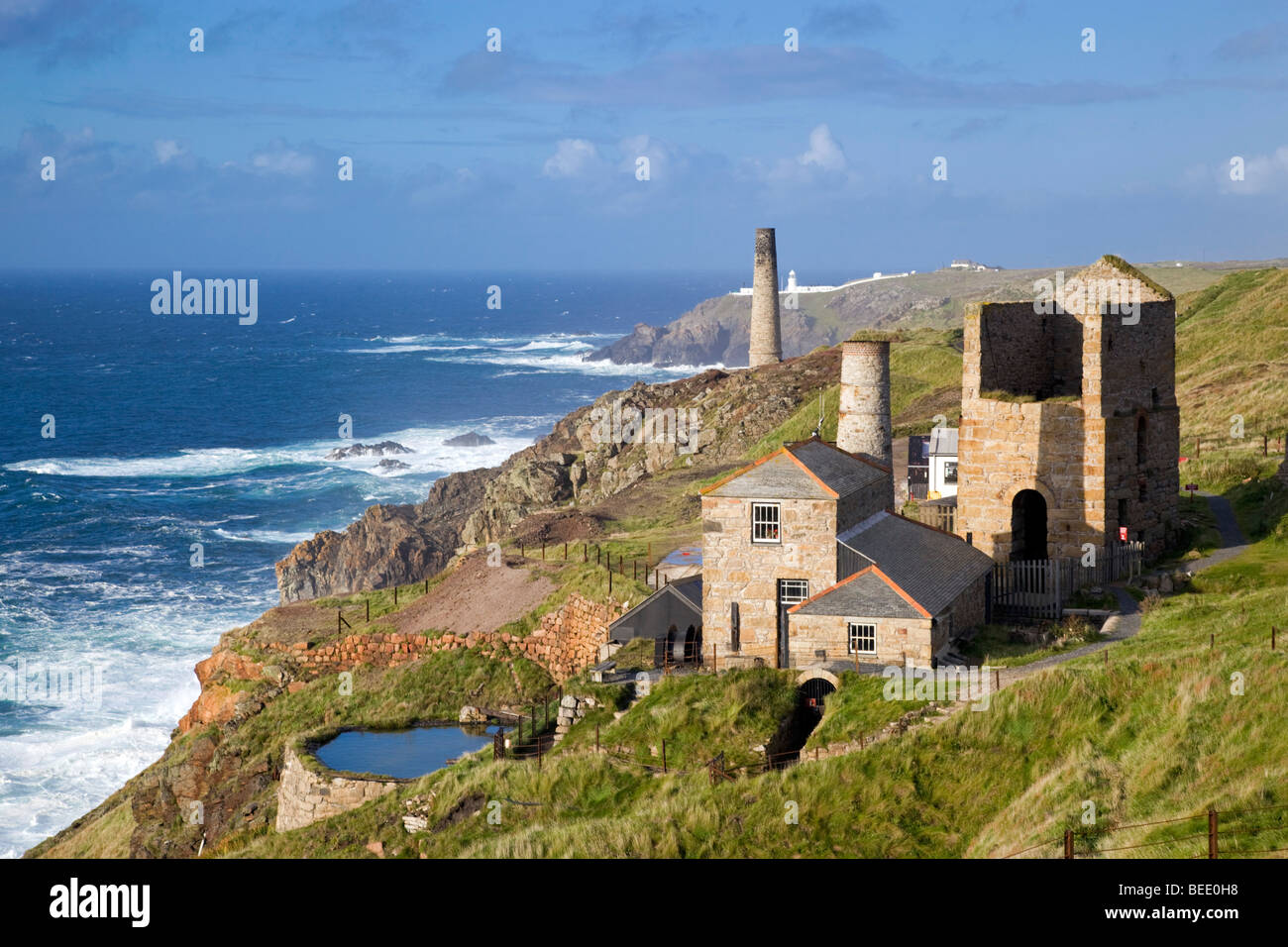 Levant mine buildings; Pendeen lighthouse beyond; Cornwall Stock Photo