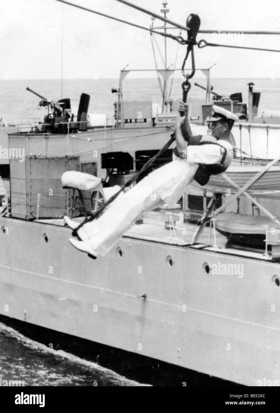 Prince Philip is lifted onto a boat to talk with marines Stock Photo