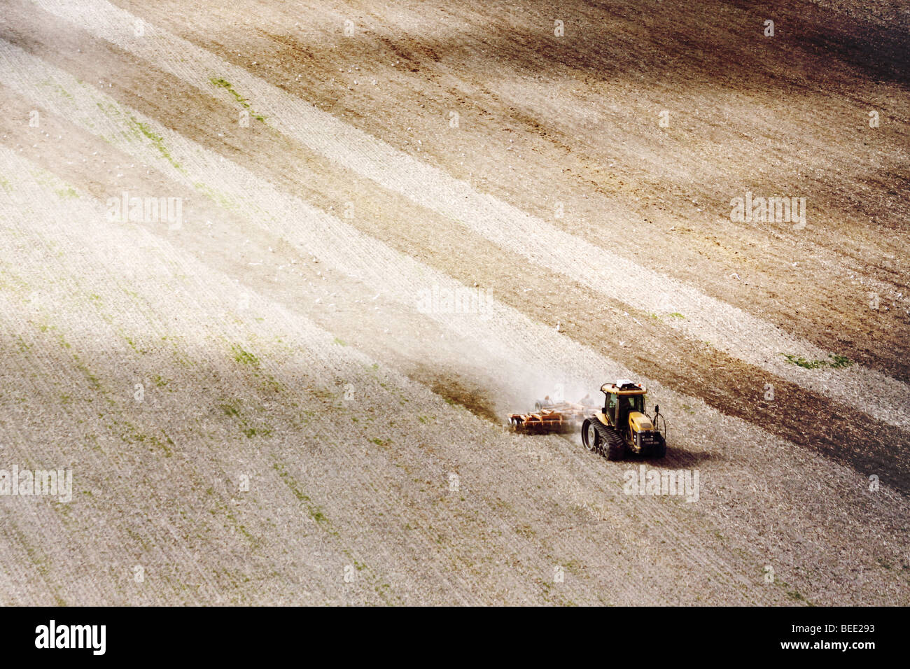 Farmer ploughing the fields in September Stock Photo