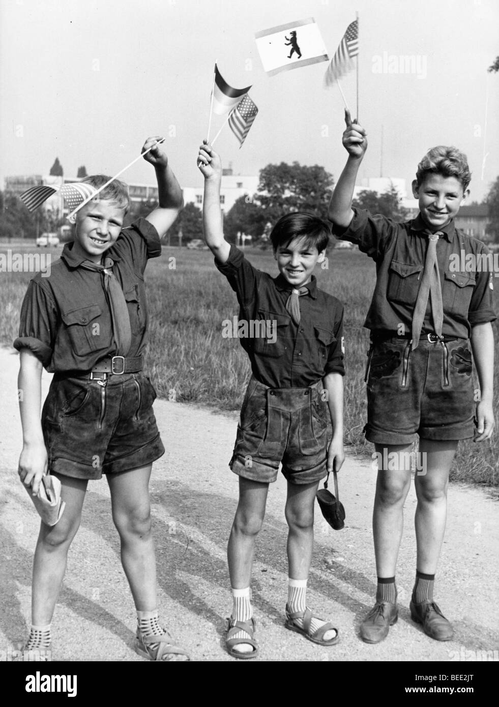 Aug 24, 1959; Bonn, Germany; Schoolchildren on the route from Bonn with German and American flags greeting President Stock Photo