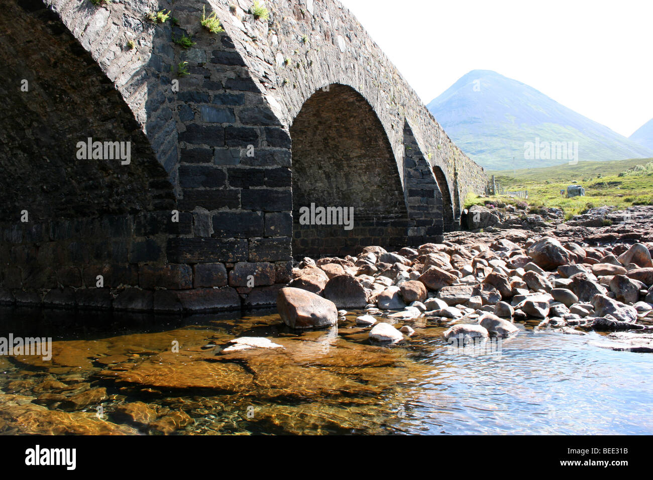 The old bridge Sligachan River, with Glamaig beyond in the Red Hills, Isle of Skye, Scotland Stock Photo