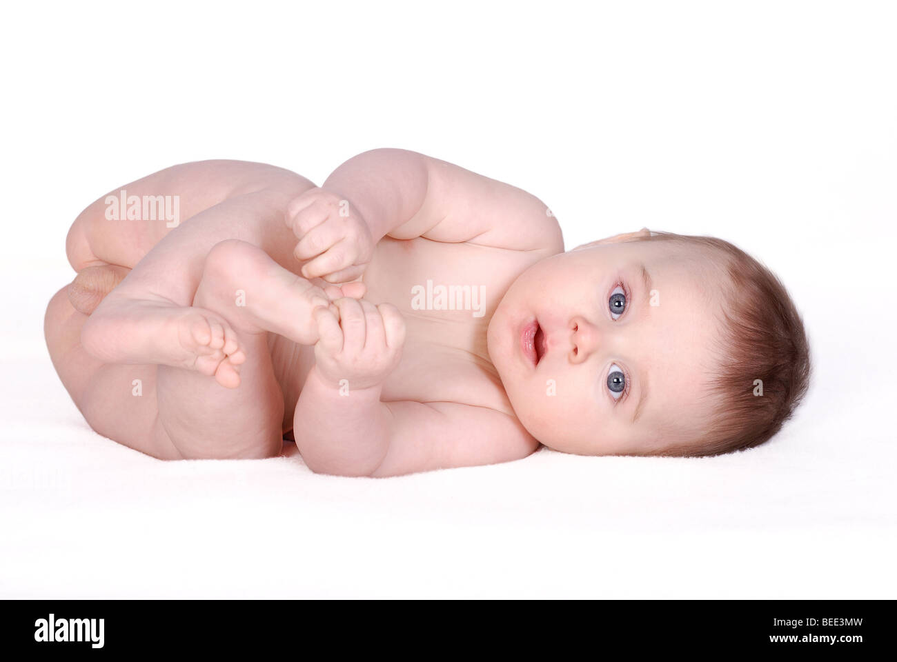 Laying baby on white background Stock Photo