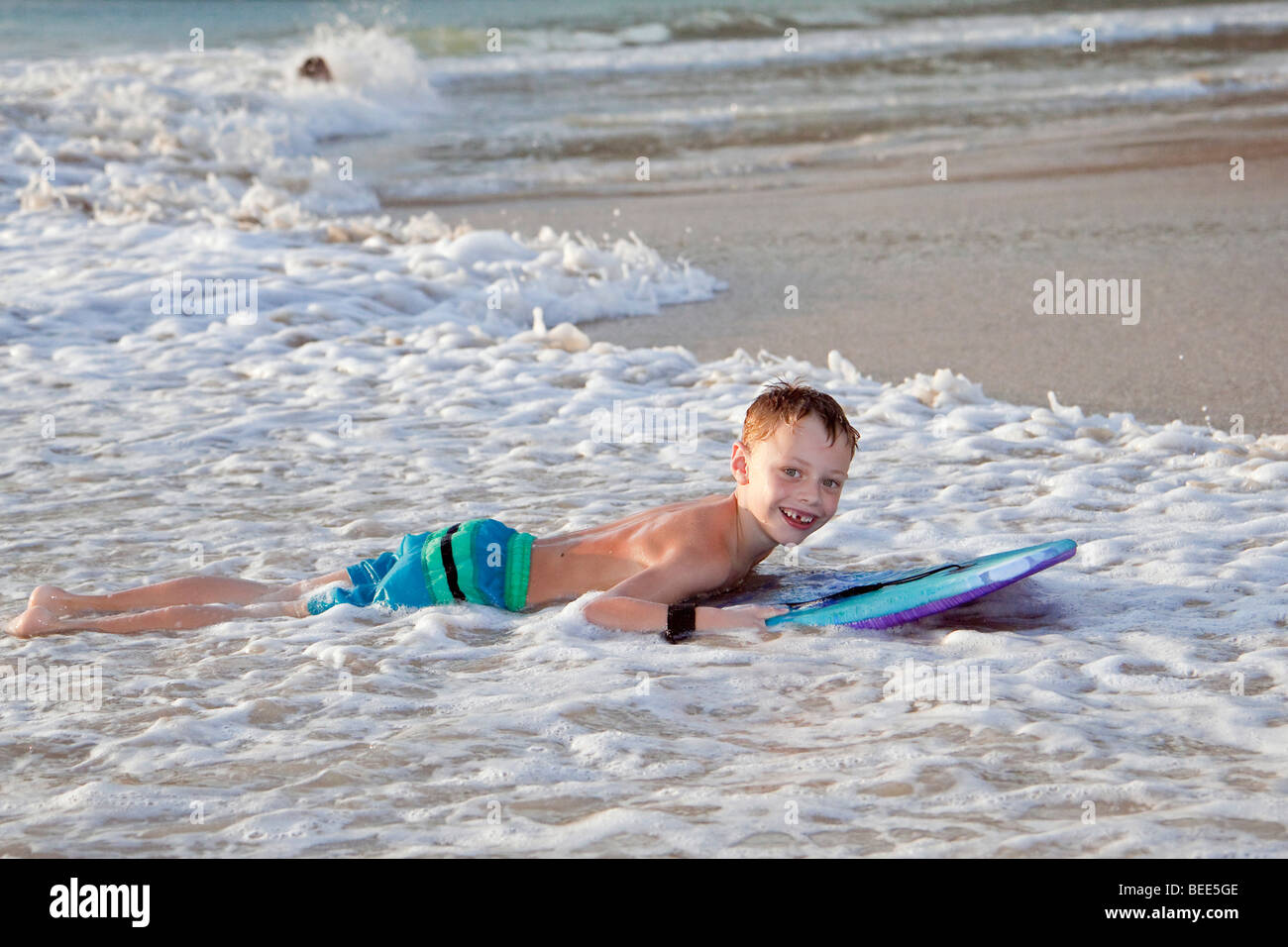 6yearold boy with a kickboard Nai Harn Beach Phuket Island Southern