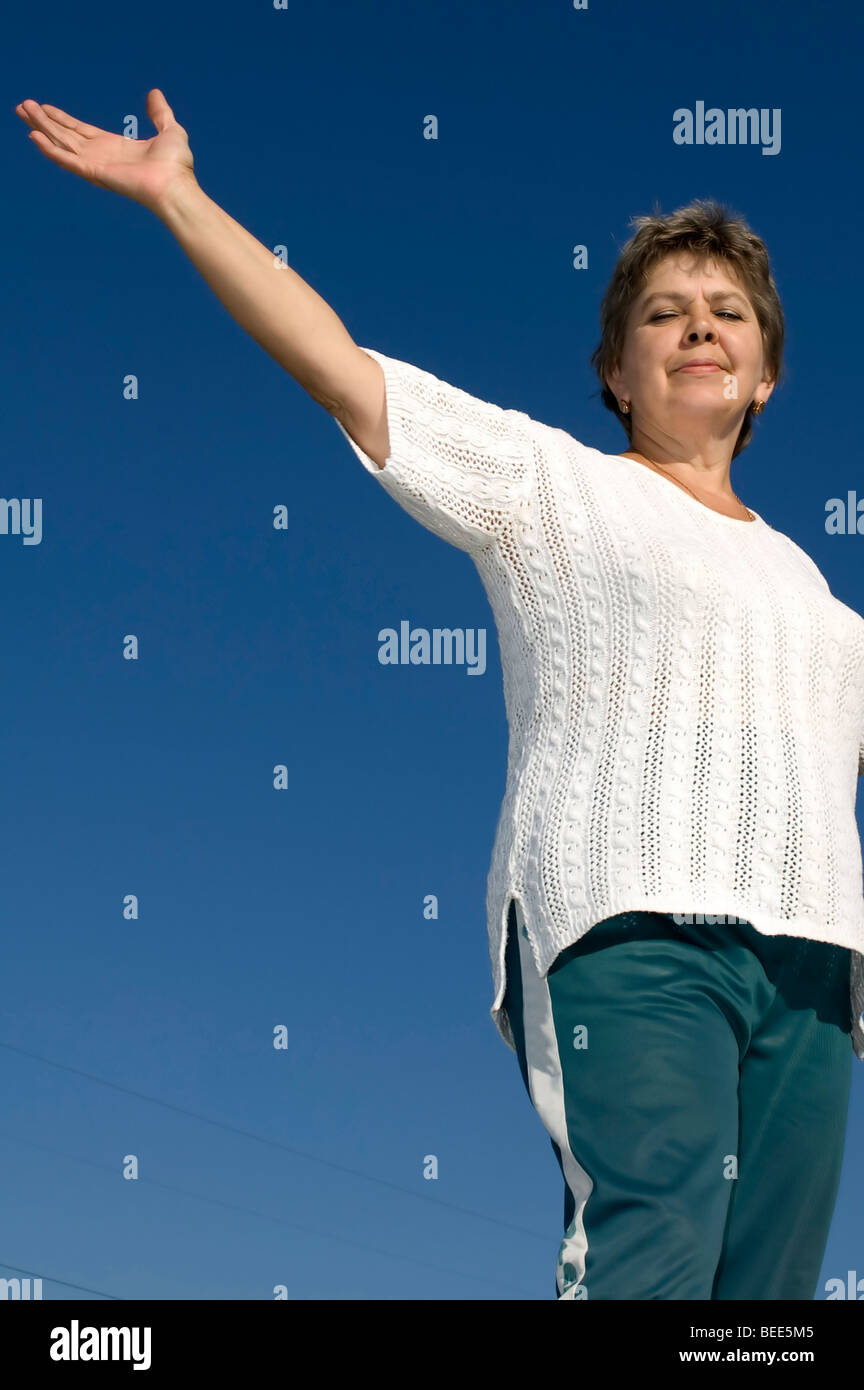 woman with smile on blue sky and clouds Stock Photo - Alamy