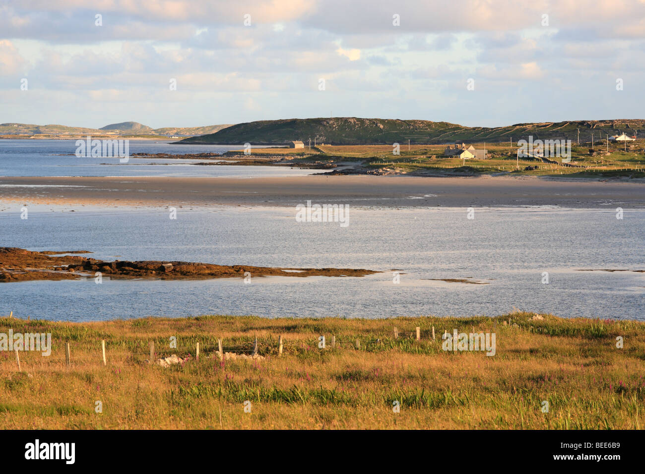 View from Claddaghduff to Omey Island near Clifden and Cleggan at sunset, Connemara, Ireland Stock Photo