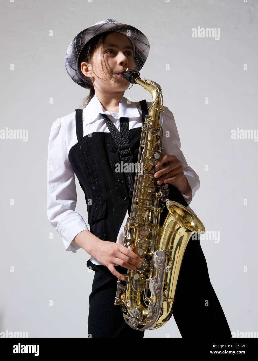 Girl playing the saxophone Stock Photo