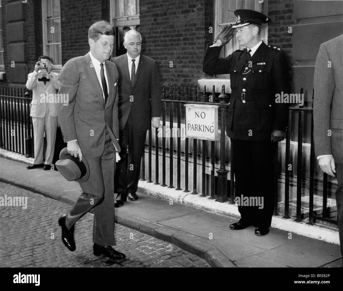 US President John F Kennedy arrives at No.10 Downing Street for a visit with British Prime Minister McMillan. Stock Photo
