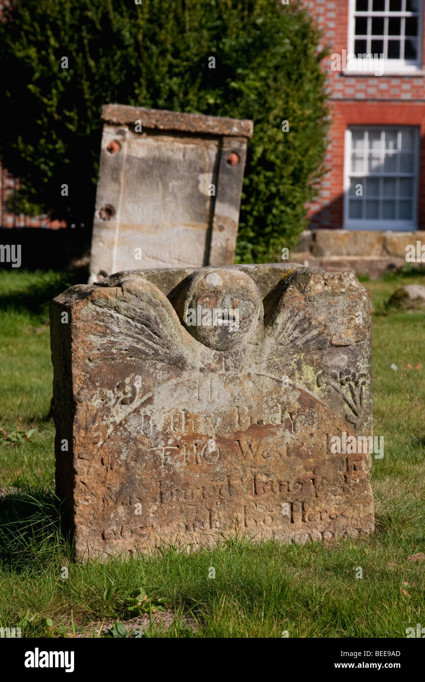 Old gravestone with angel carved into it in Waldron village in sussex england Stock Photo Alamy
