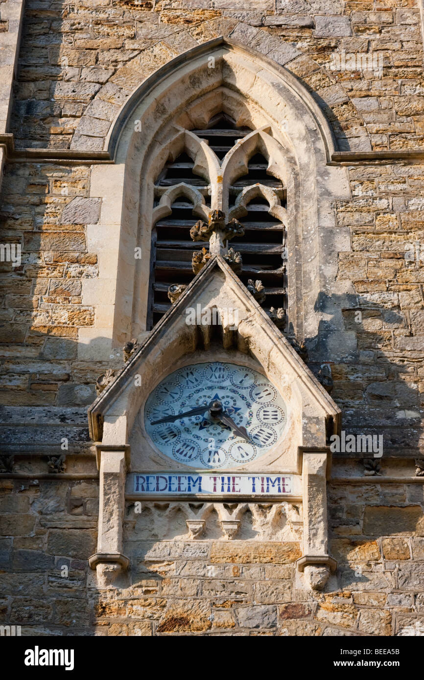 "Redeem the time" inscribed on a church clock in Sussex England Stock
