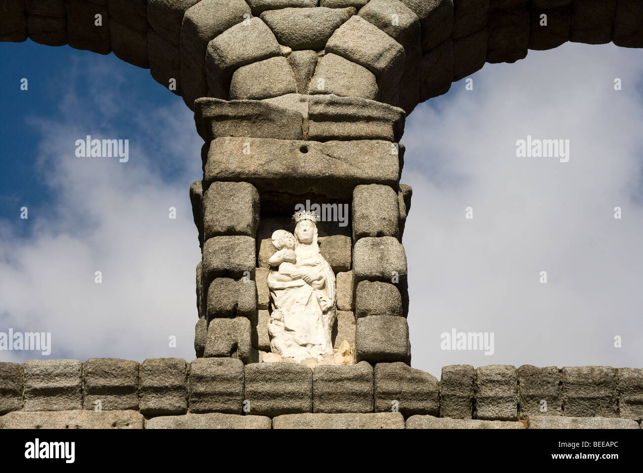 Statue of Virgin Mary and baby Jesus on Roman water aqueduct, detail, Segovia, Spain Stock Photo