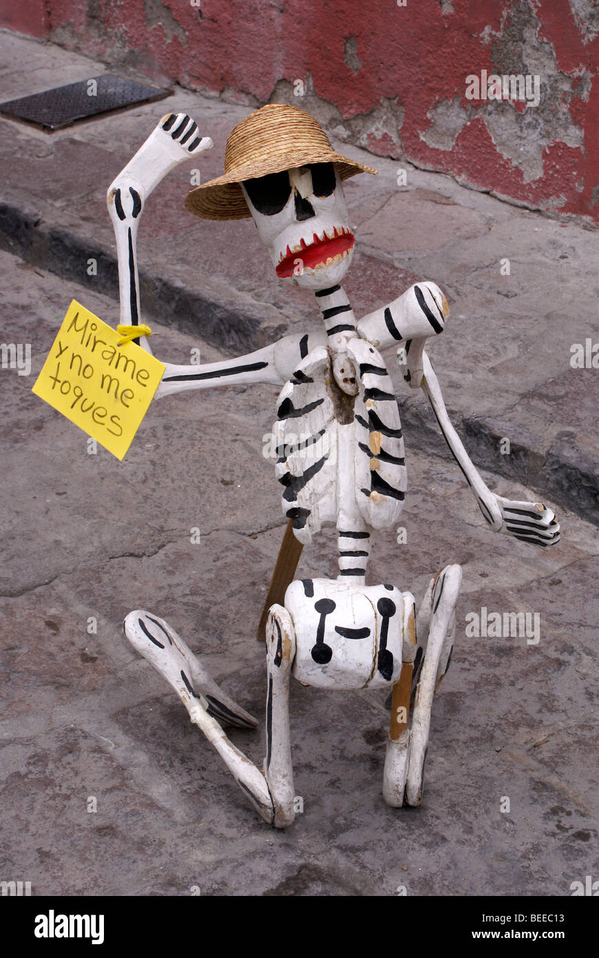 Kneeling skeleton figure outside a handicrafts store in San Miguel de Allende, Mexico Stock Photo