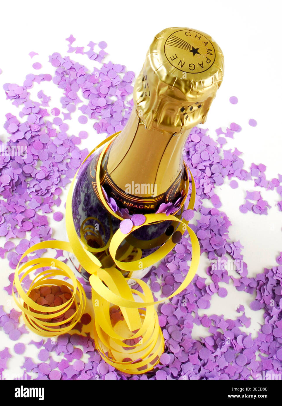 Champagne bottle with streamers and confetti Stock Photo