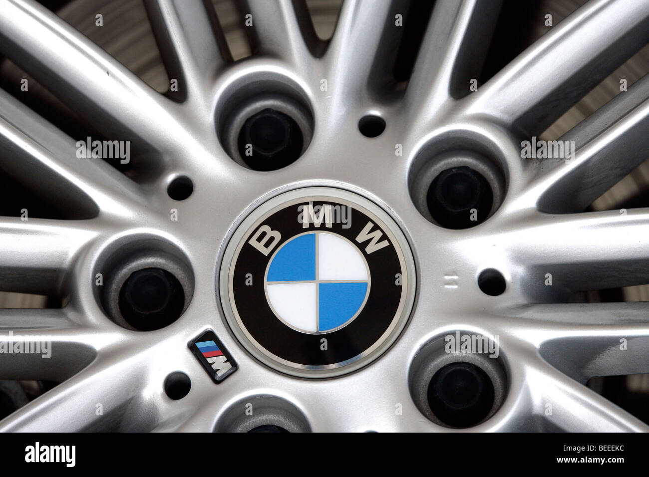 Aluminium wheel rim of a BMW 3 with company logo Stock Photo