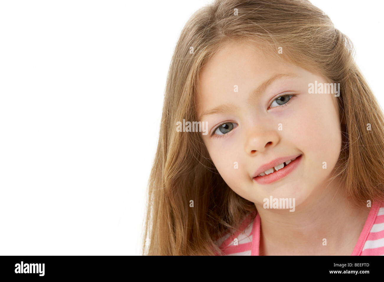 Studio Portrait of Smiling Girl Stock Photo