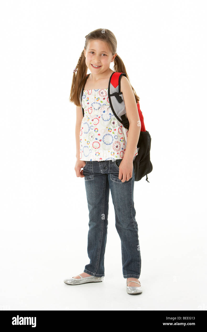 Studio Portrait of Girl Standing with backpack Stock Photo