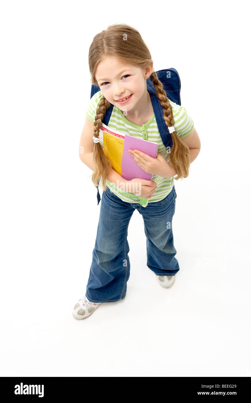Studio Portrait of Smiling Girl Holding School Book Stock Photo - Alamy