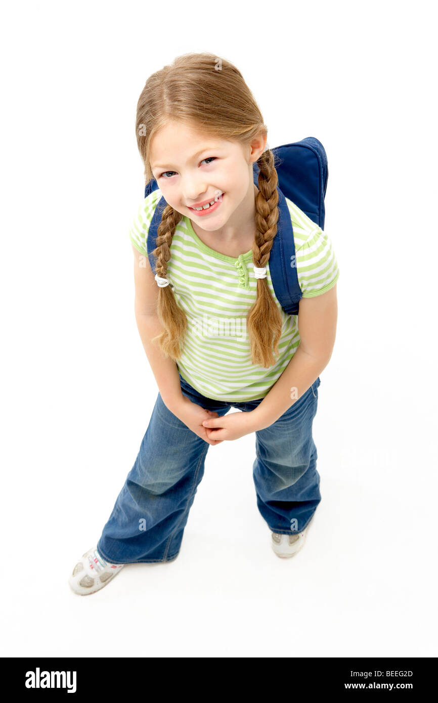 Studio Portrait of Smiling Girl Wearing School Bag Stock Photo