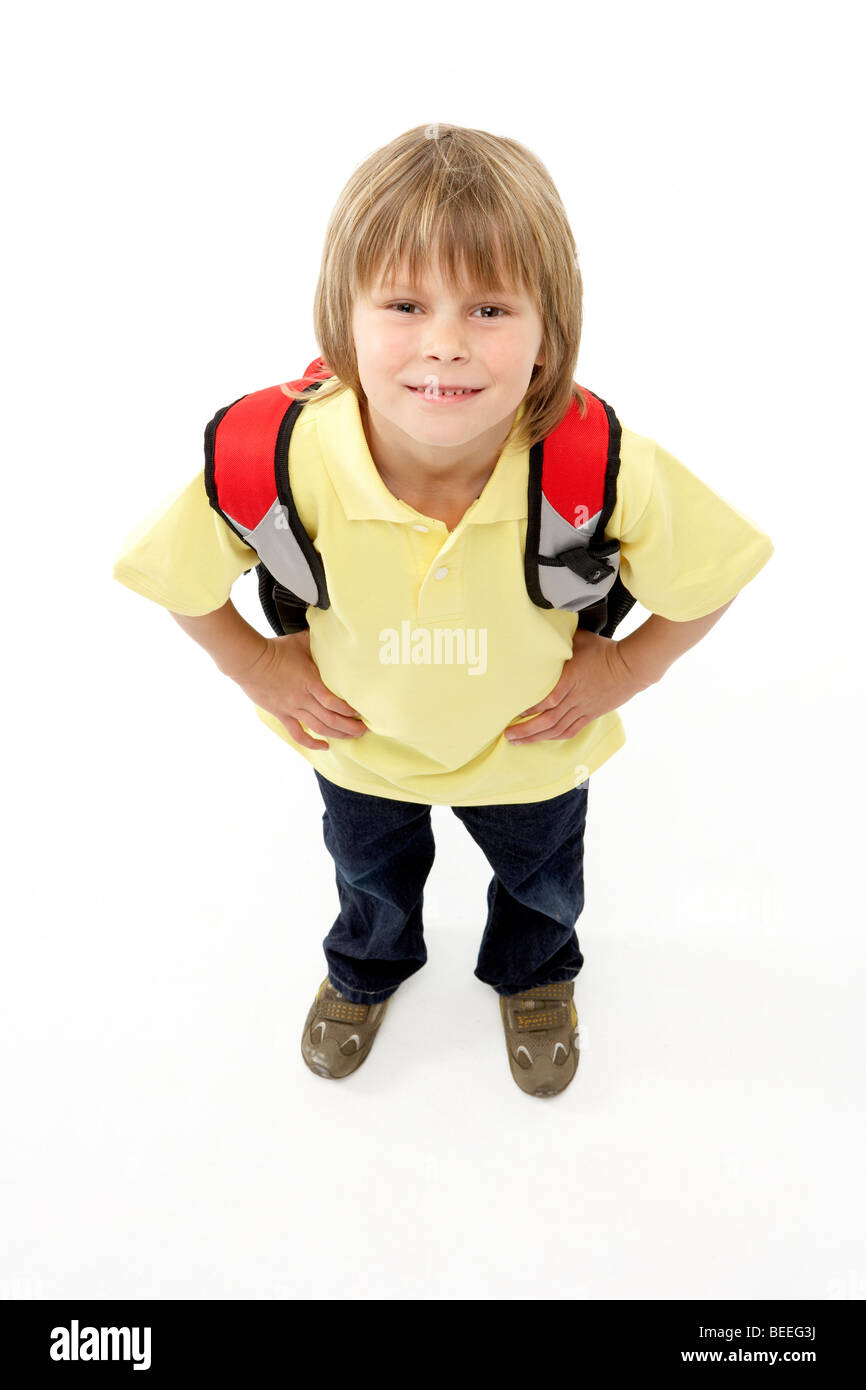 Studio Portrait of Smiling Boy Holding Ruck Sack Stock Photo
