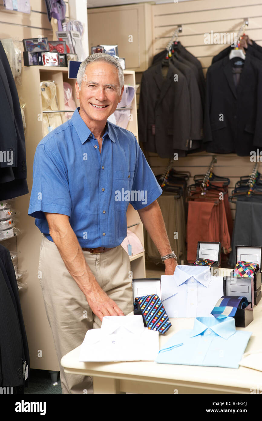 Male sales assistant in clothing store Stock Photo