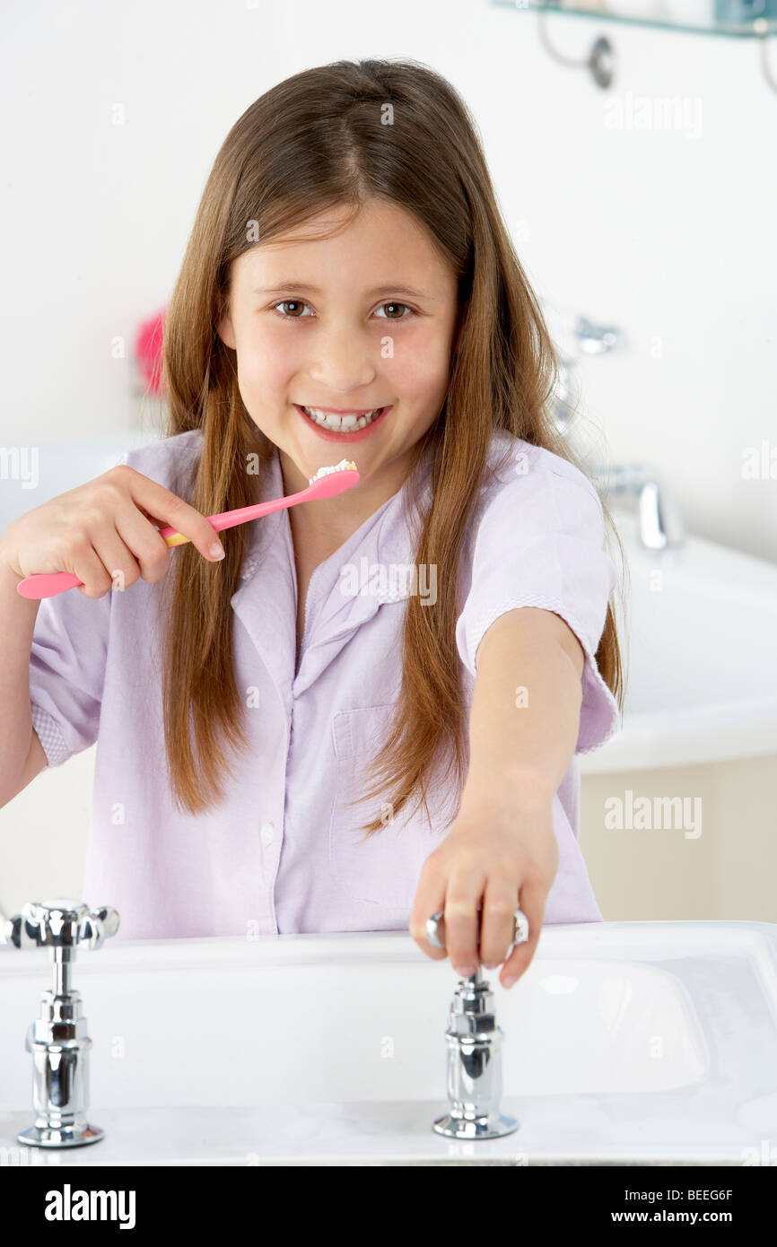 Young Girl Brushing Teeth at Sink Stock Photo Alamy