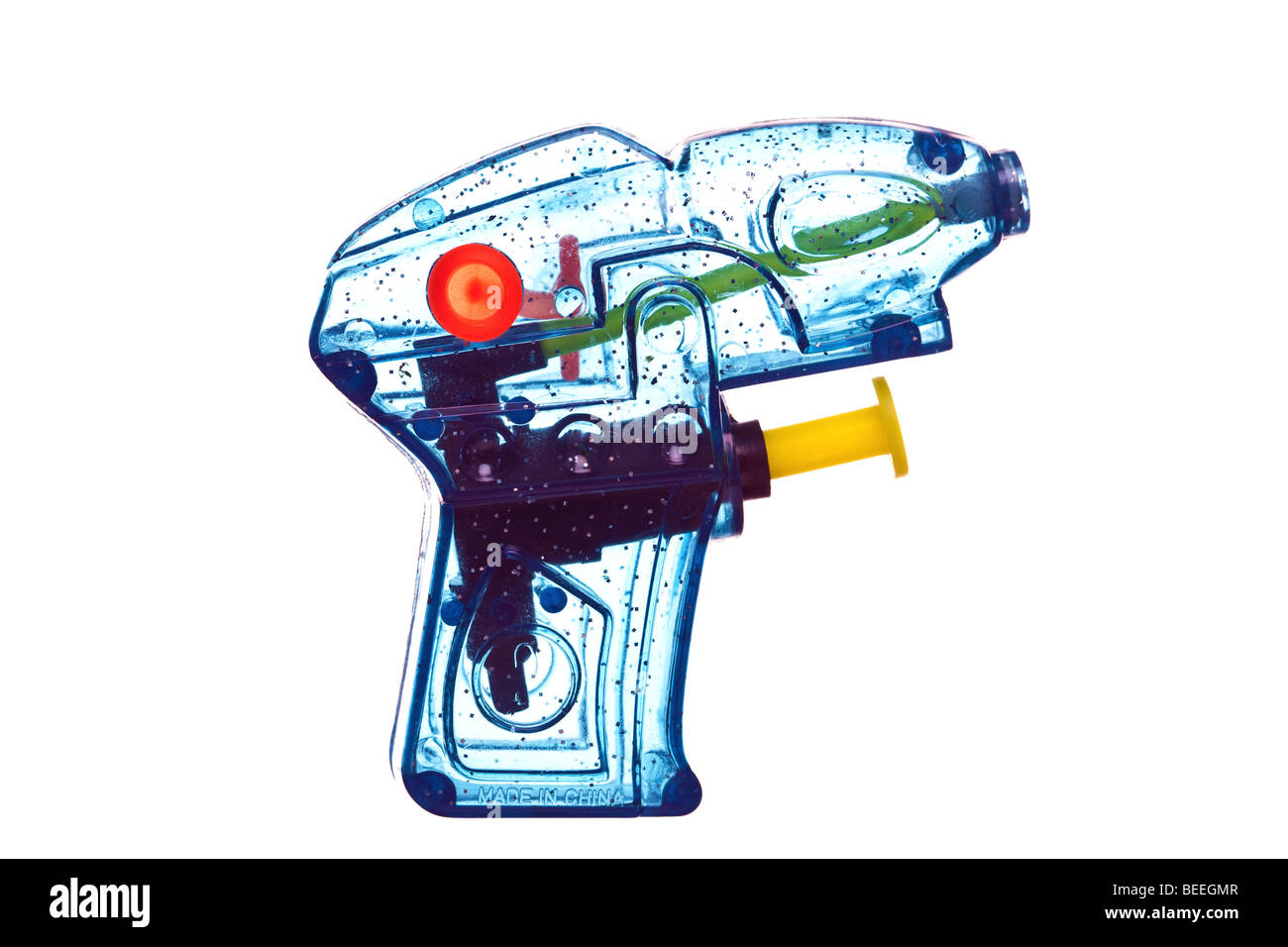 Blue transparent plastic water pistol isolated on a white background. Stock Photo
