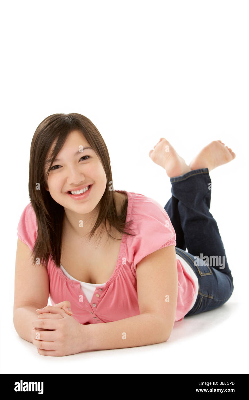 Teenage Girl Laying on Stomach Stock Photo
