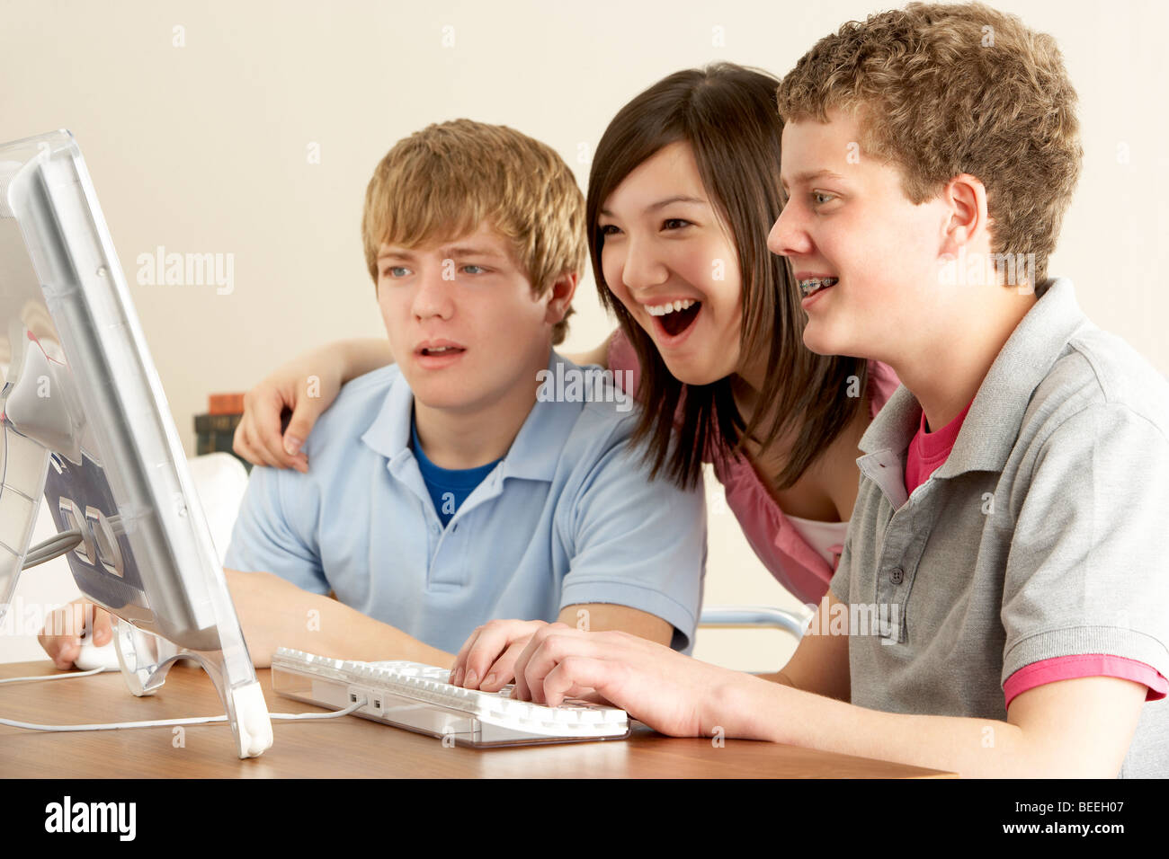 Teenagers on Computer at Home Stock Photo