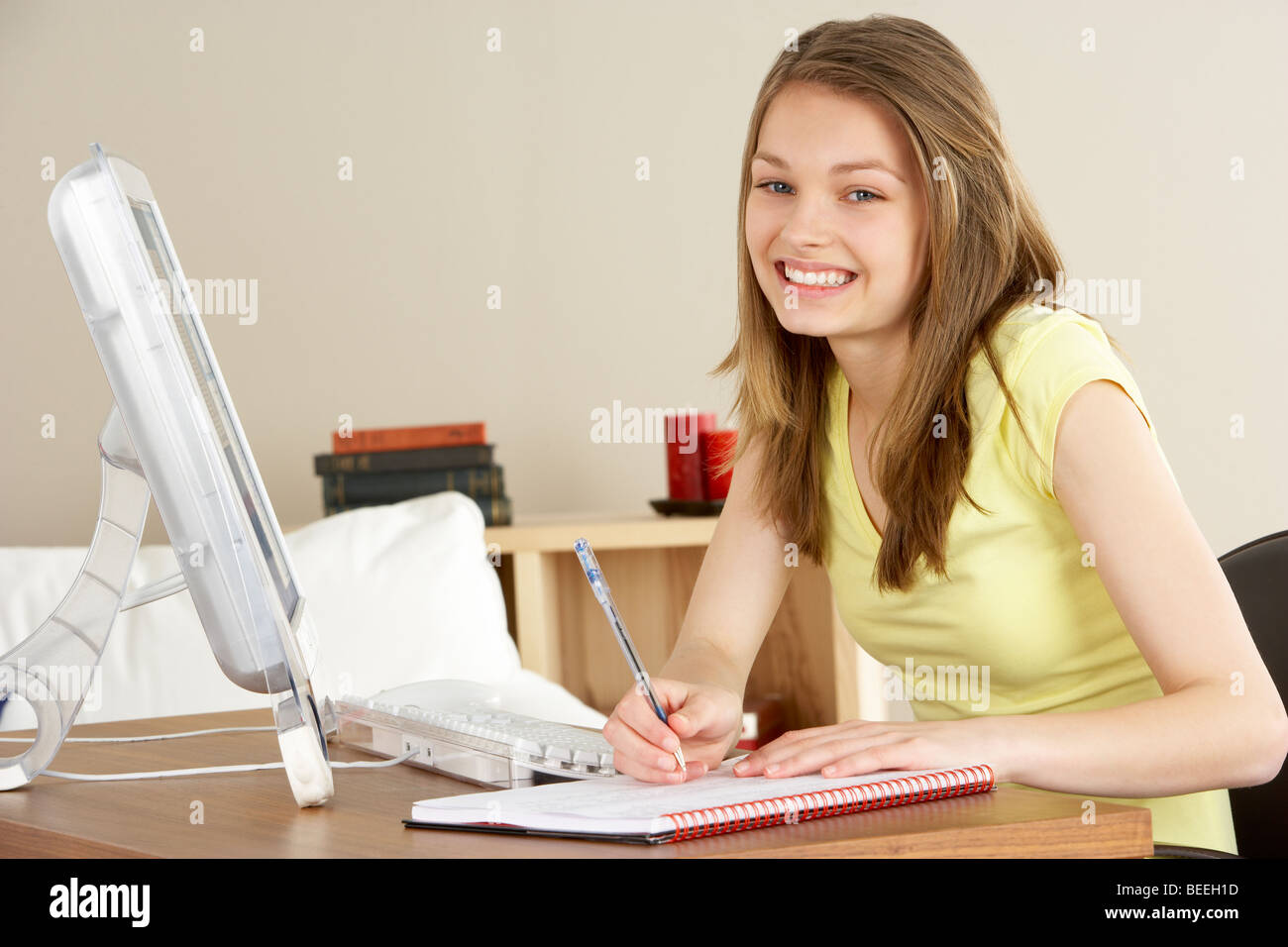 Smiling Teenage Girl Studying at Home Stock Photo - Alamy