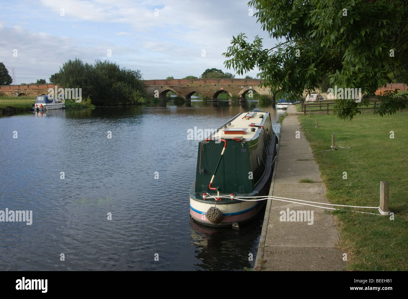 canal barge moored on river ouse near bridge Stock Photo