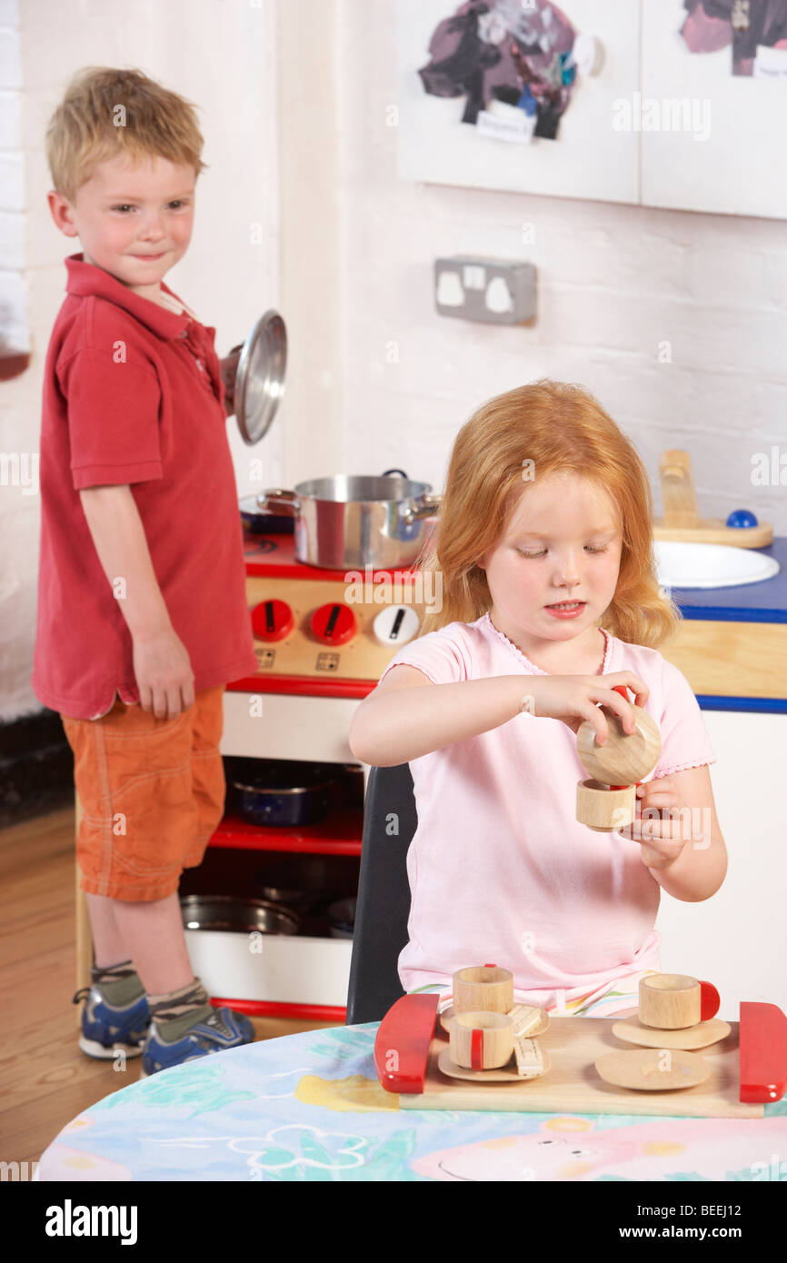 Two Young Children Playing Together at Montessori/Pre-School Stock Photo