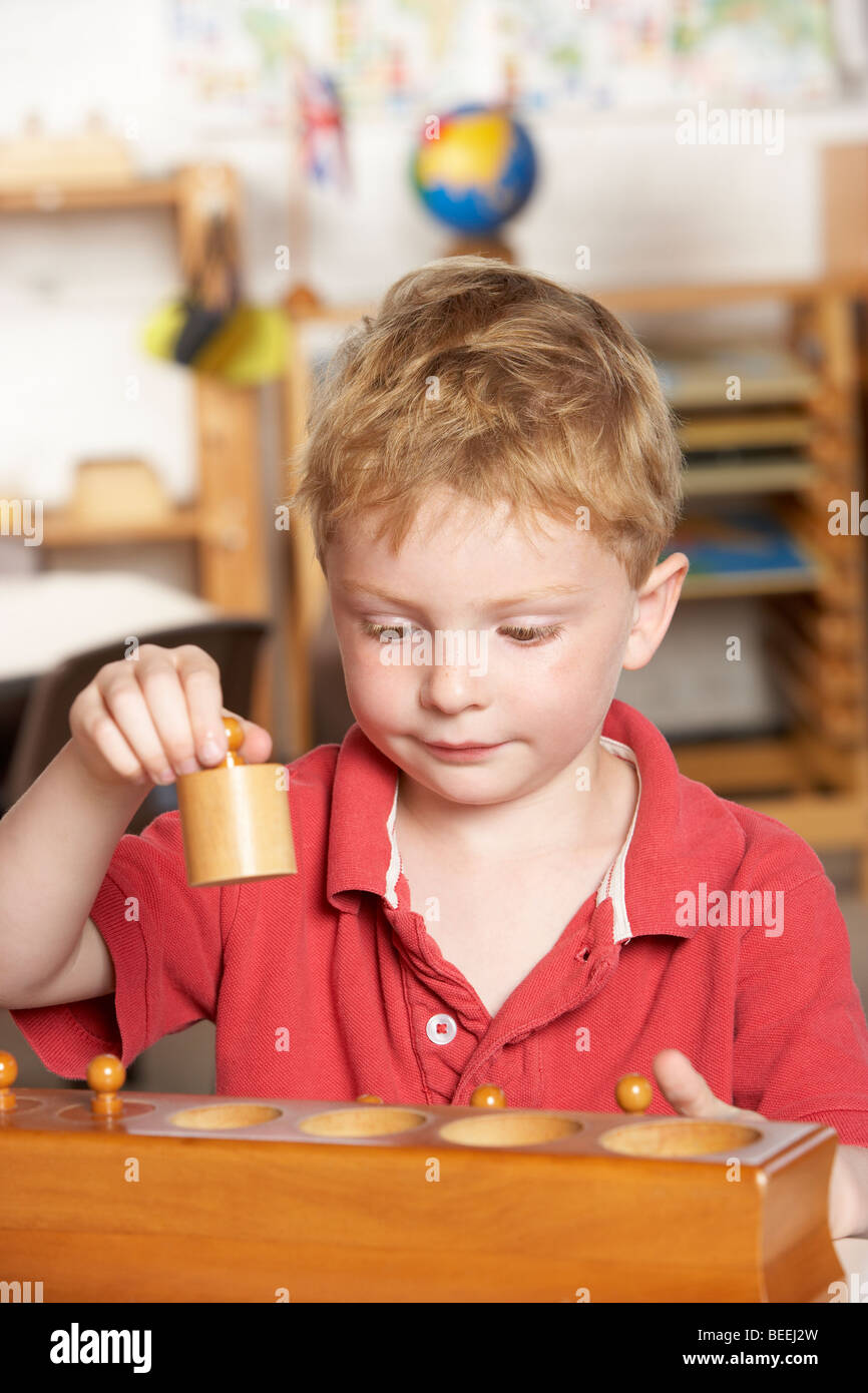 Young Boy Playing at Montessori/Pre-School Stock Photo