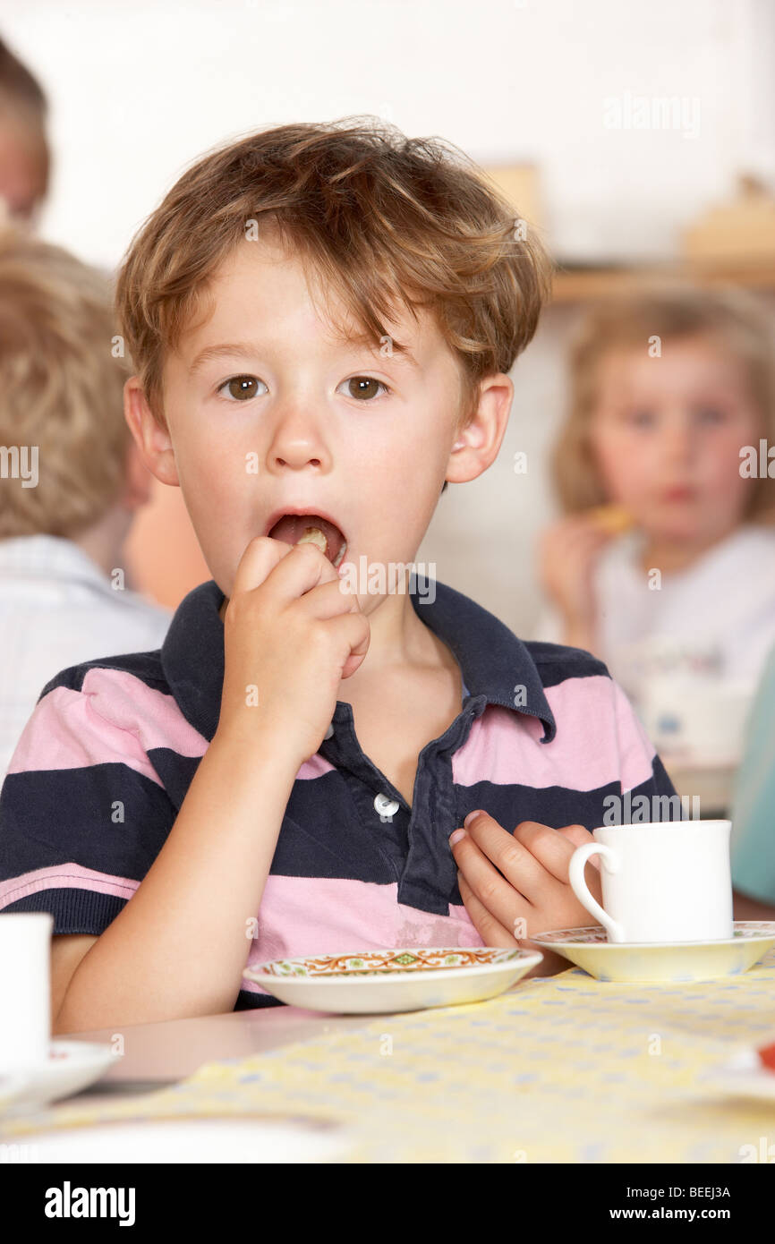 Adult Playing with Two Children at Montessori/Pre-School Stock Photo