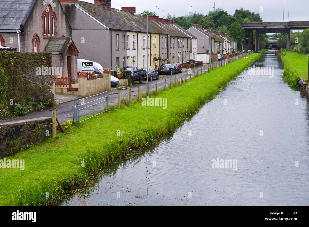 Neath Canal with houses alongside at Aberdulais near Neath South Wales UK Stock Photo