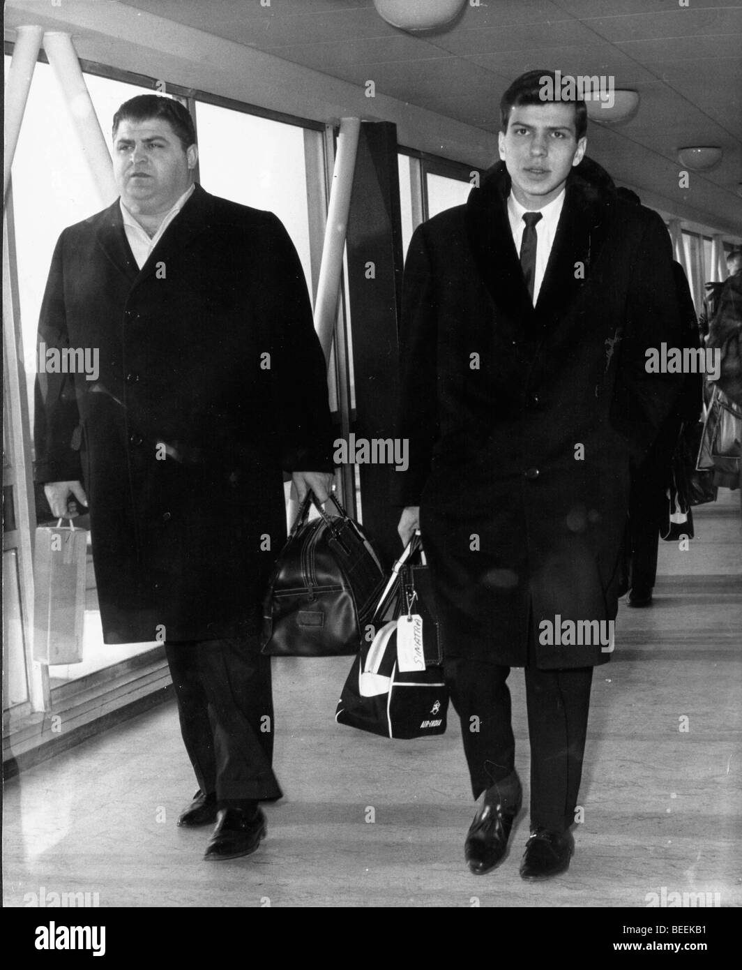 Singer Frank Sinatra Jr. at the airport with his bodyguard Stock Photo