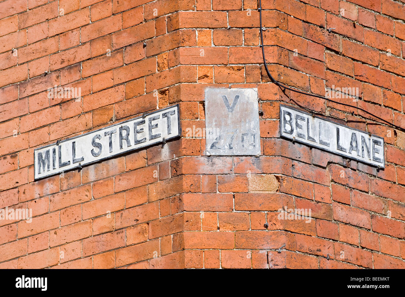 Street signs at corner of MILL STREET and BELL LANE in Ludlow Shropshire England UK Stock Photo