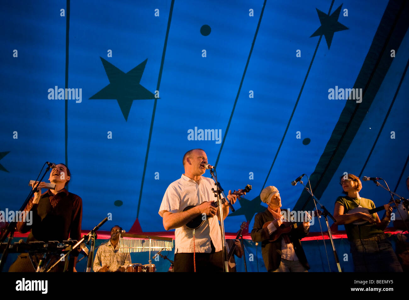 Members of the Dulwich Ukulele Club perform under the marquee at Myatts  Fields Fair in South London Stock Photo - Alamy