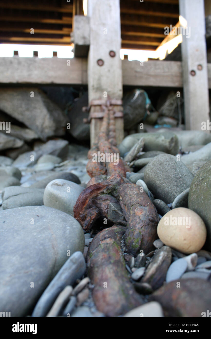 A chain down at a local harbour Stock Photo