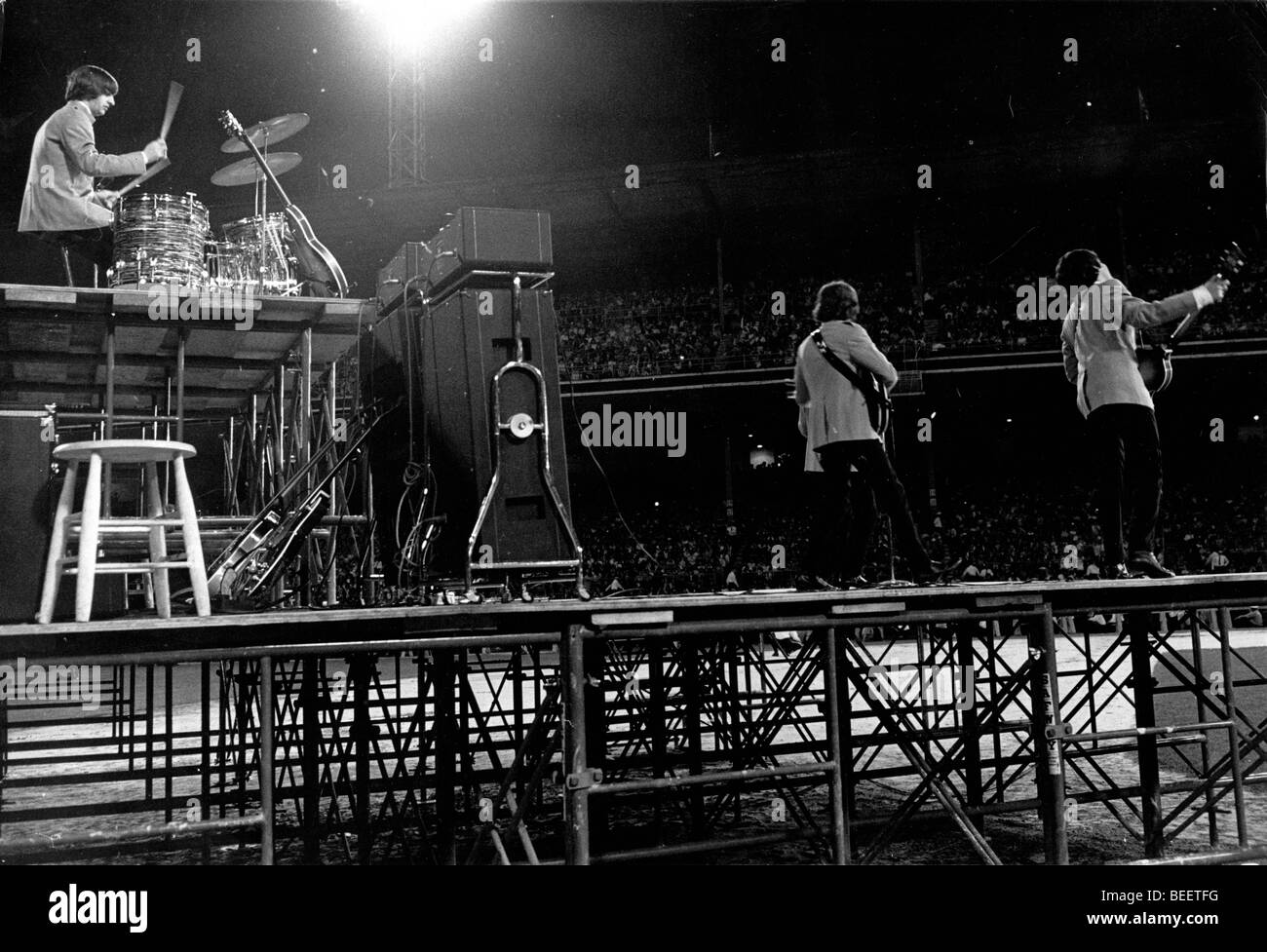 The Beatles during a concert at Shea Stadium Stock Photo